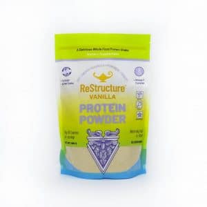 Dr Carolyn Dean's Restructure™ Protein Powder Vanilla in a sealed packet on a white background